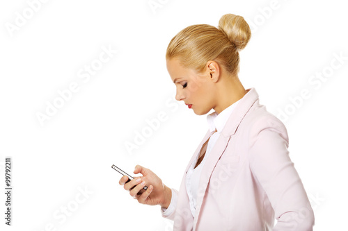 Young business woman using a mobile phone
