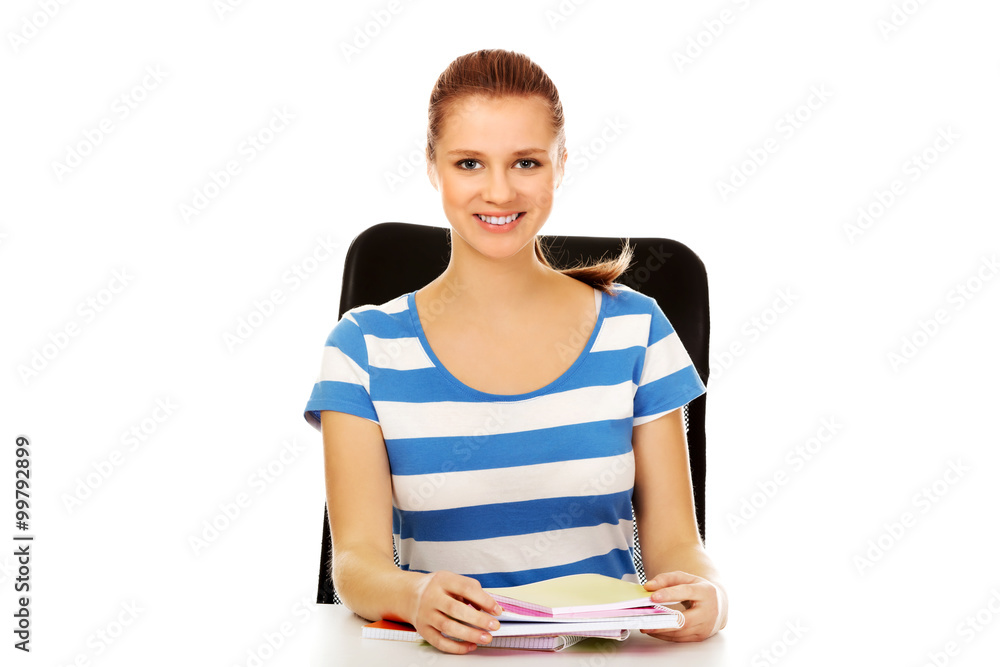 Teenage woman learning at the desk