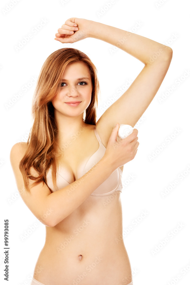 Beautiful young woman using antiperspirant Beautiful young woman using antiperspirant