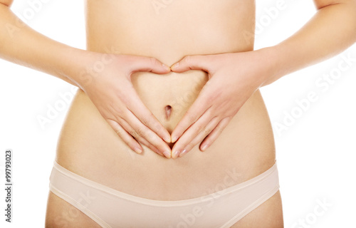 Wallpaper Mural Woman is having heart shape made from hands on her belly Torontodigital.ca