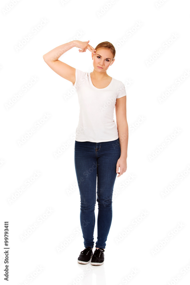 Young woman committing suicide with finger gun gesture Young woman committing suicide with finger gun gesture