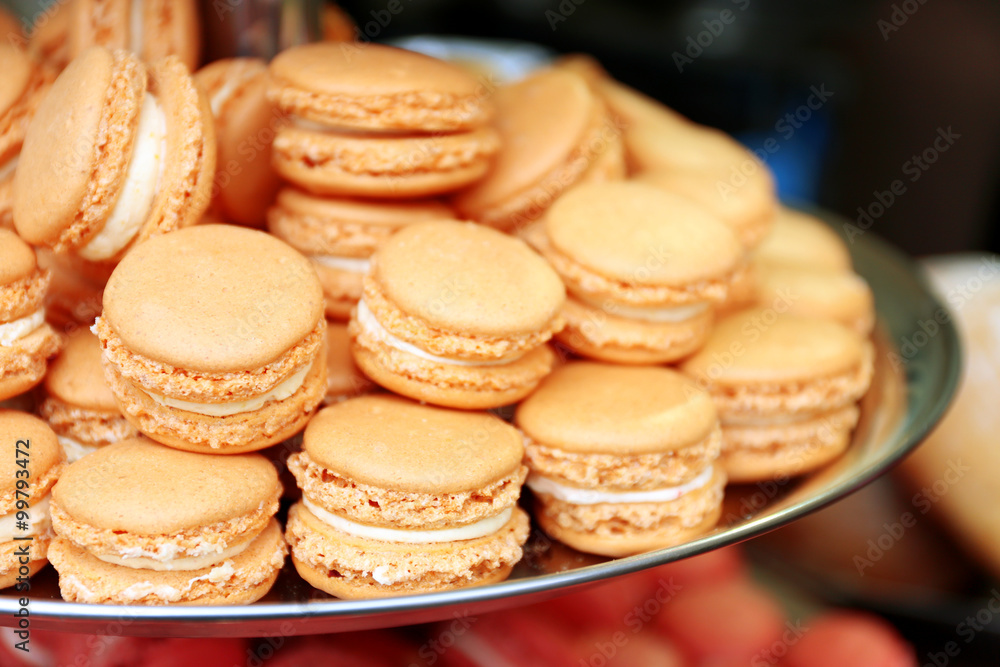 Beige macaroons on plate closeup Beige macaroons on plate closeup