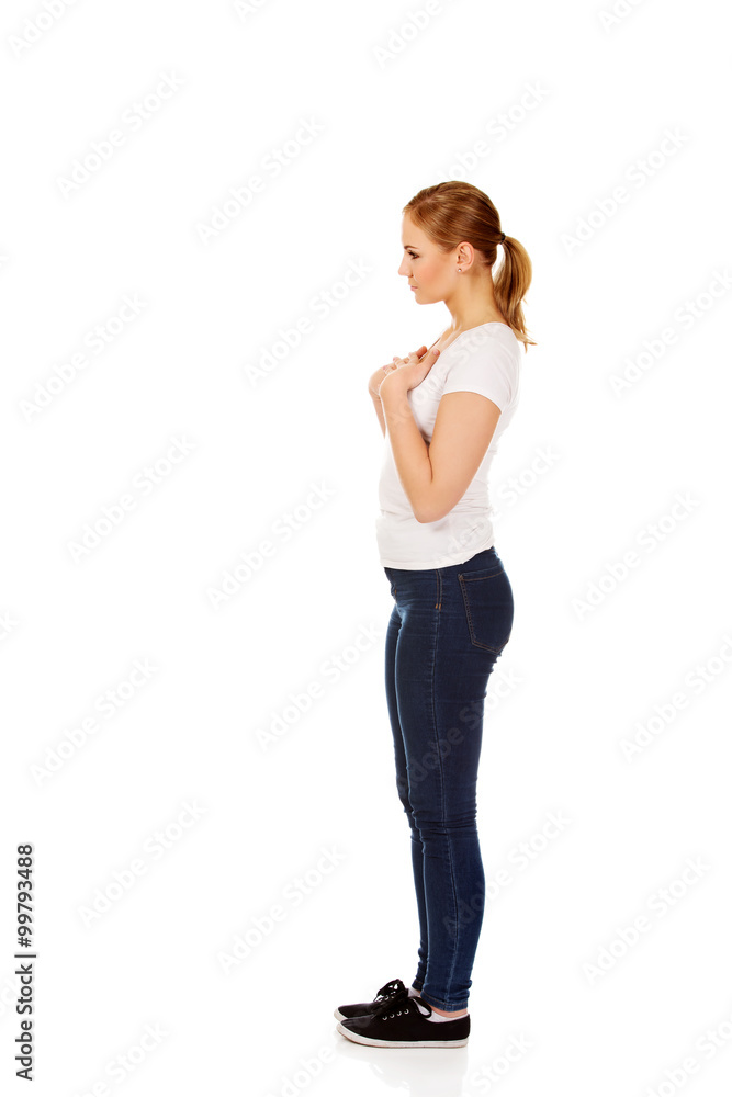 Side view of worried and sad young woman Side view of worried and sad young woman