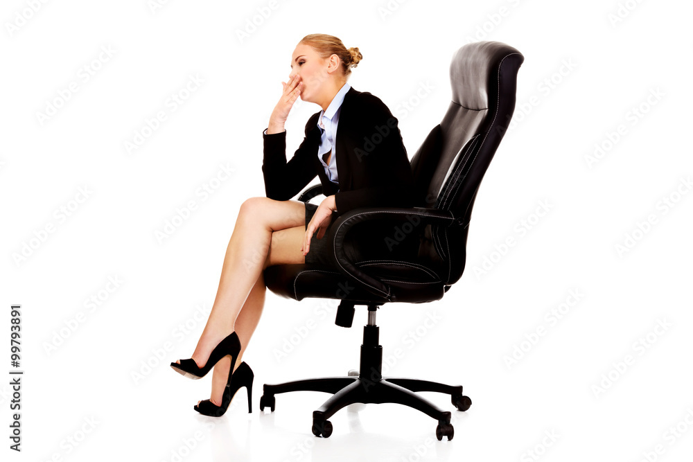 Tired or worried business woman sitting on armchair Tired or worried business woman sitting on armchair