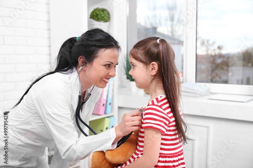Doctor examining a child in...