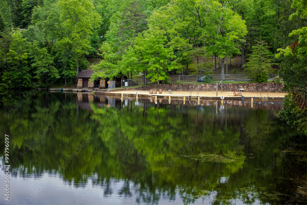Fototapeta premium Tennessee Mountain Lake. Appalachian Mountain lake with public beach, boathouse and docks at Pickett State Park in Jamestown, Tennessee.