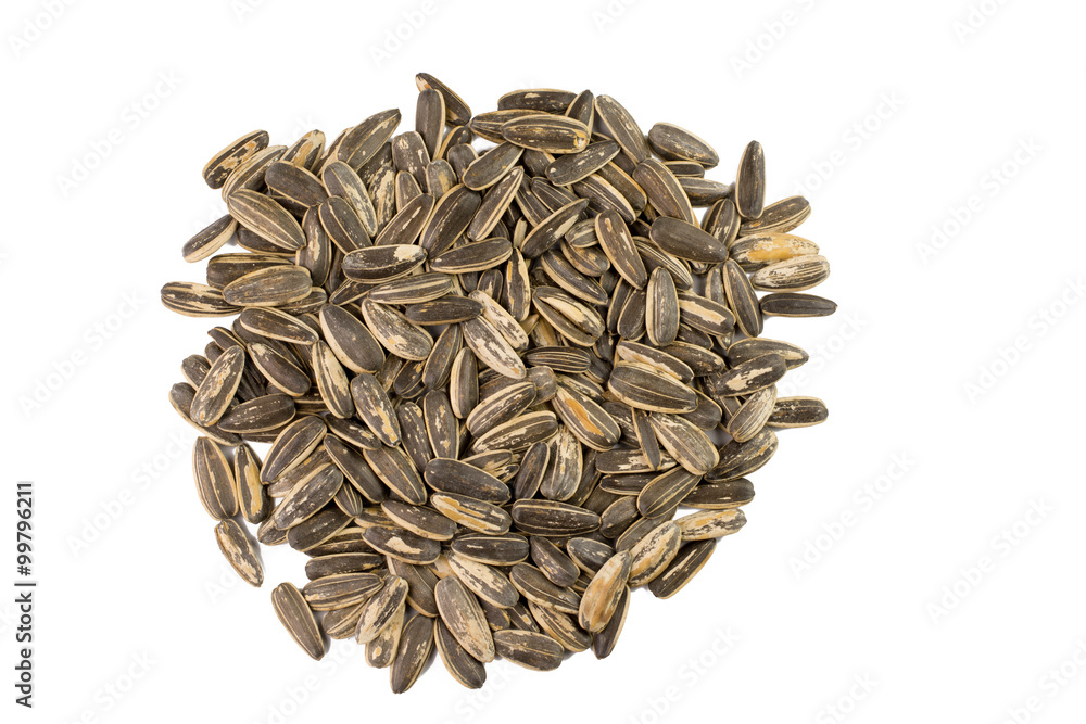 sunflower seeds pile against white background sunflower seeds pile against white background