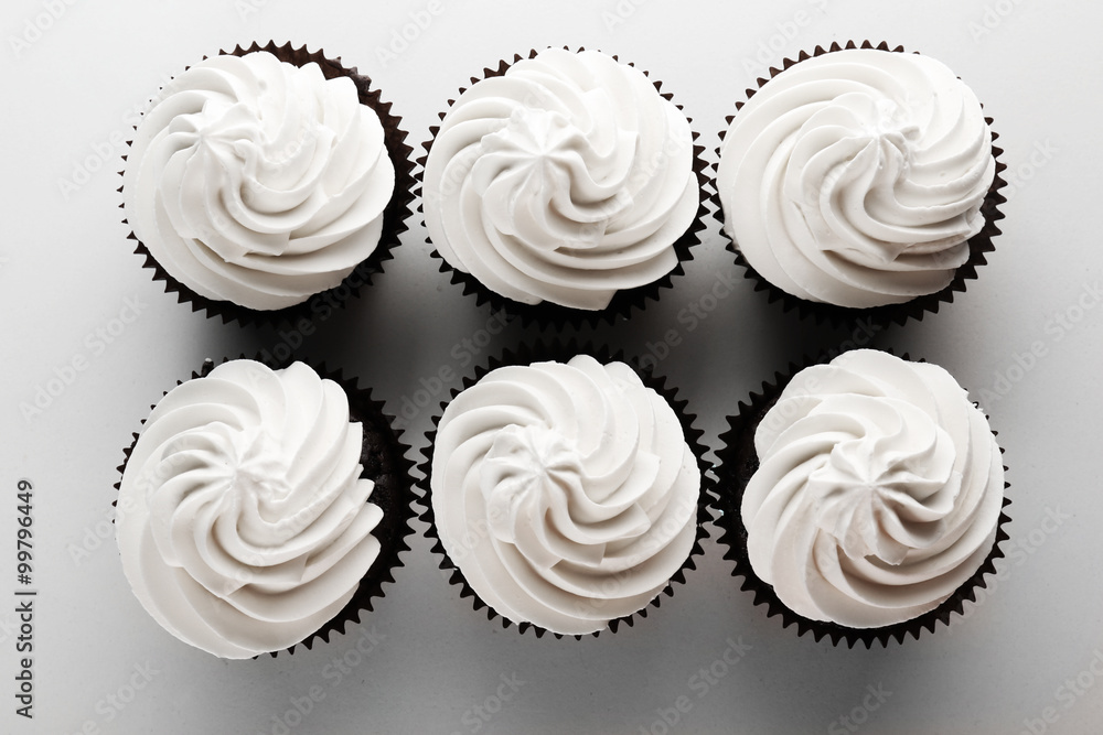 Tasty cupcakes isolated on white background Tasty cupcakes isolated on white background