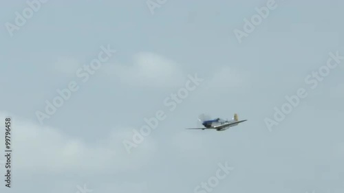 North American P-51 Mustang fighter plane flies past during an air display.  Recorded in 4K, ultra high definition.