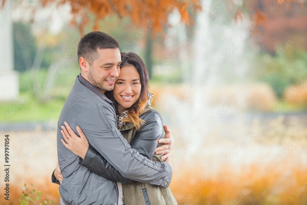 Affectionate young couple embracing in a park Affectionate young couple embracing in a park