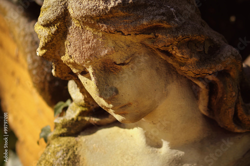 Majestic view of statue of golden angel illuminated by sunlight © zwiebackesser