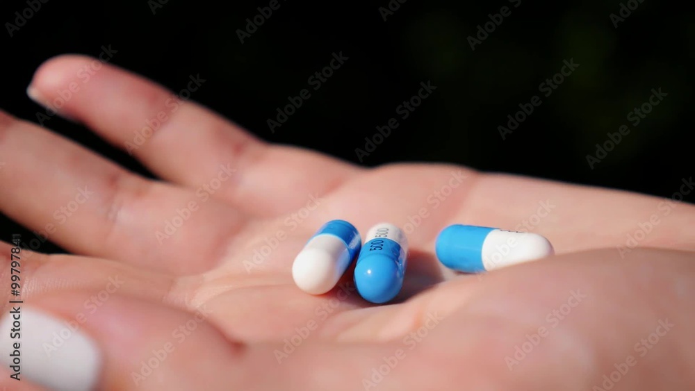 Close-up of Female Hand Holding Pills Close-up of Female Hand Holding Pills
