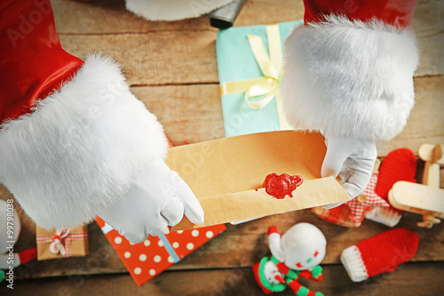 Envelop in Santa hands and ...