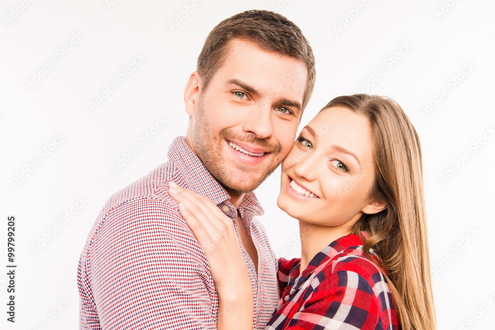 Close up photo of cheerful hugging couple in love Close up photo of cheerful hugging couple in love