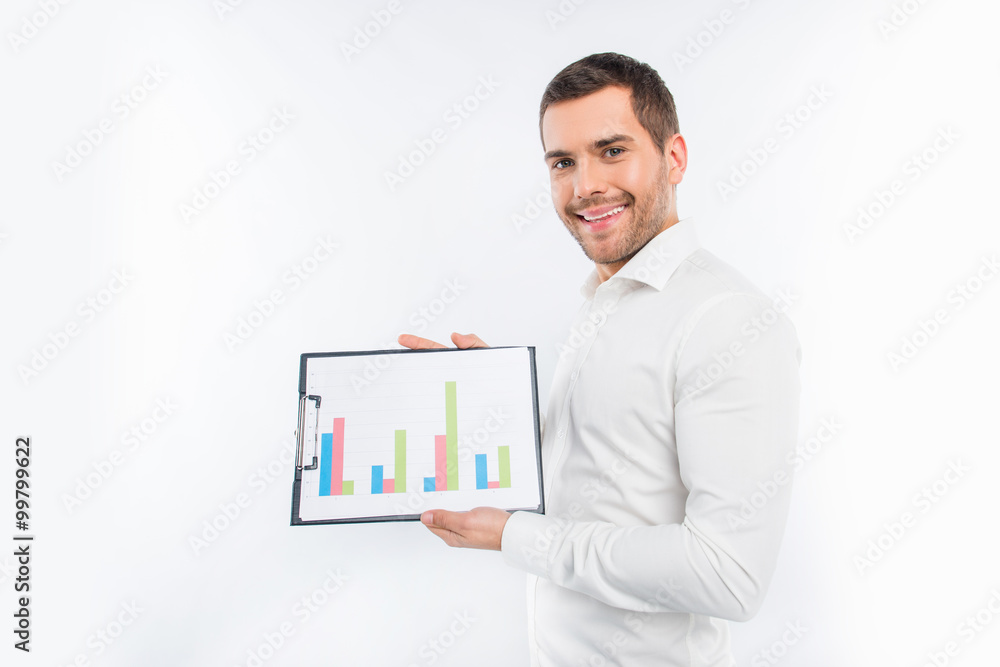 Attractive young man showing a diagrama Attractive young man showing a diagrama