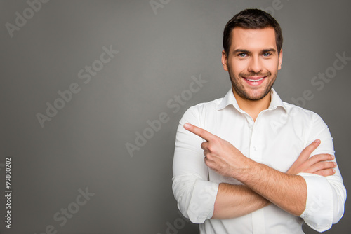 Portrait of smaling man gesturing with crossed hands photo