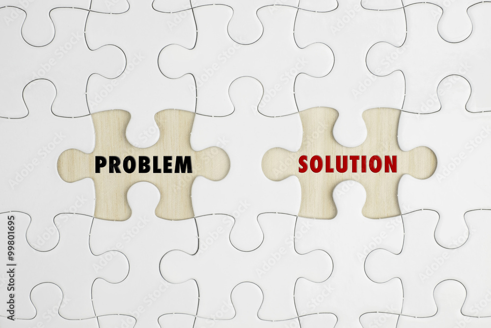 Jigsaw puzzle on wood background with a word PROBLEM and SOLUTION Jigsaw puzzle on wood background with a word PROBLEM and SOLUTION
