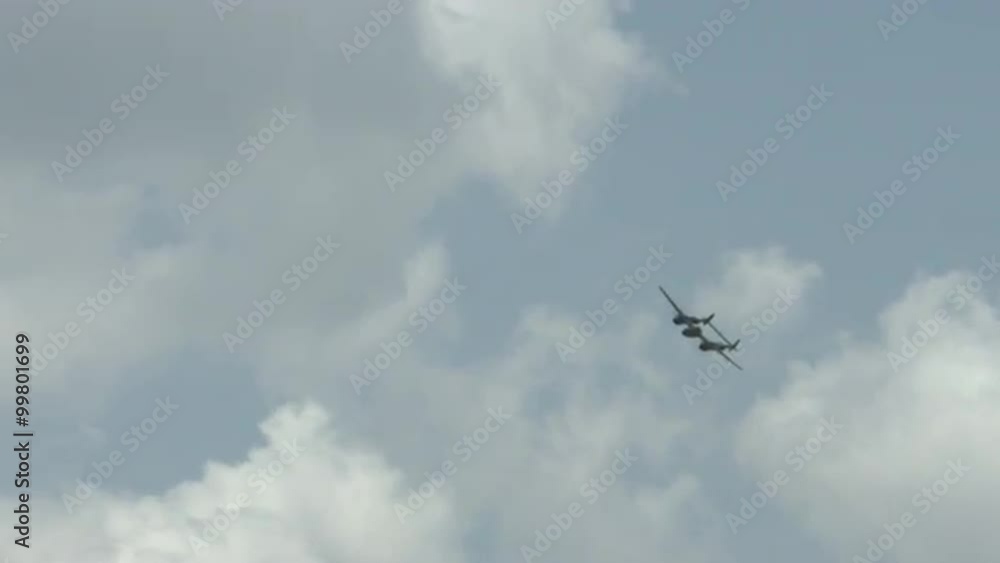 Lockheed P-38 Lightning flying in summer sky. Fighter plane used by US Air Force in World War II. Recorded in 4K, ultra high definition. Lockheed P-38 Lightning flying in summer sky. Fighter plane used by US Air Force in World War II. Recorded in 4K, ultra high definition.