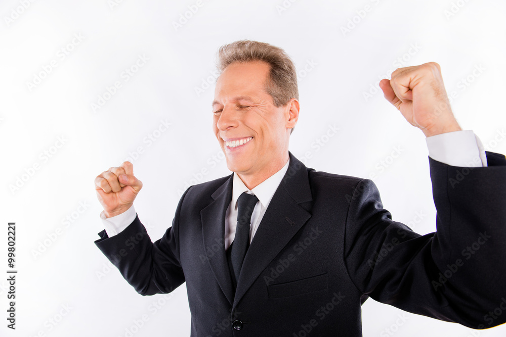 Successful happy businessman with fists raised Successful happy businessman with fists raised