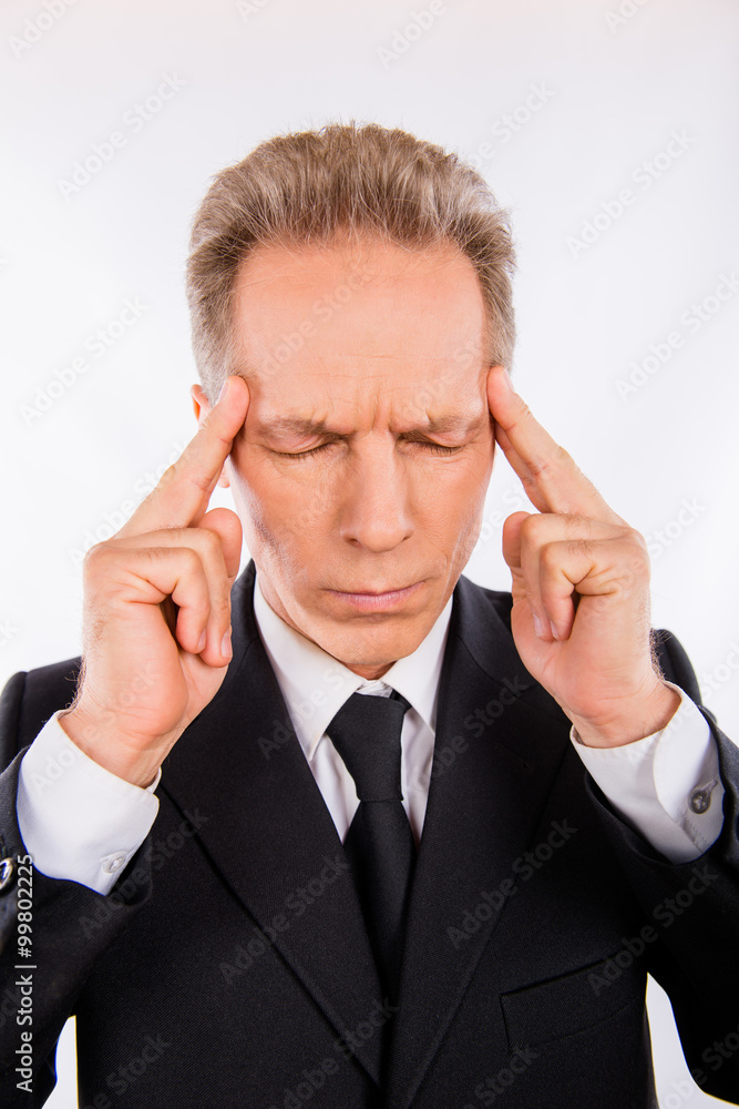 A concentrated man with headache is losting in his thoughts A concentrated man with headache is losting in his thoughts