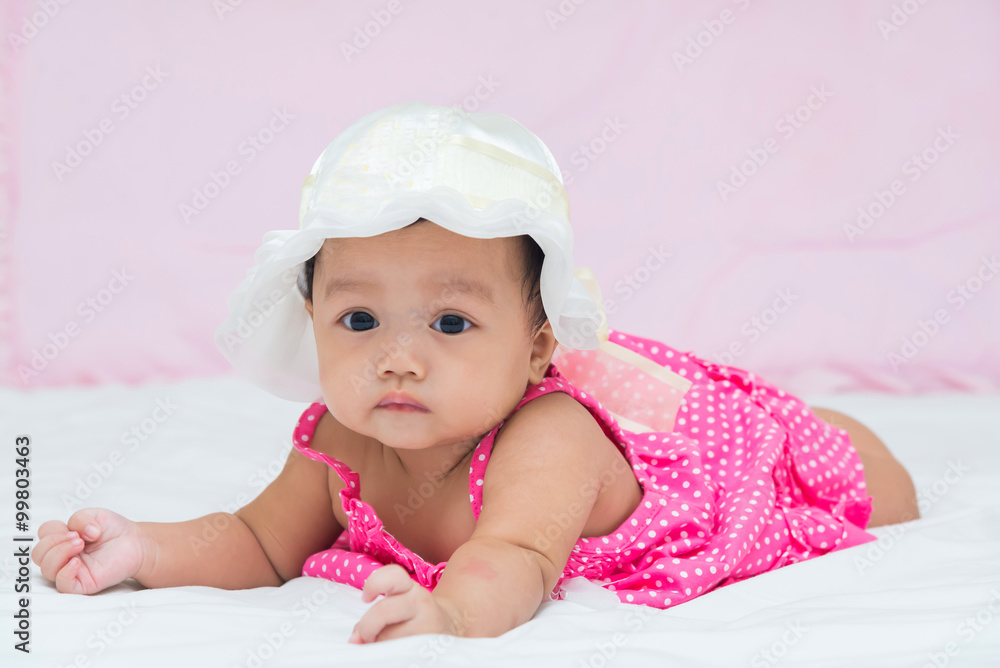 Portrait of cute newborn baby girl on the bed Portrait of cute newborn baby girl on the bed