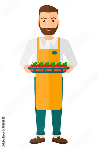 Smiling supermarket worker.