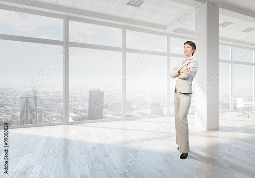 Businesswoman in top floor office