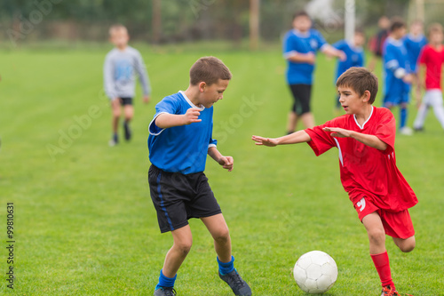 boys kicking football © Dusan Kostic