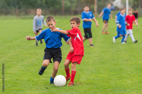 boys kicking football © Dusan Kostic