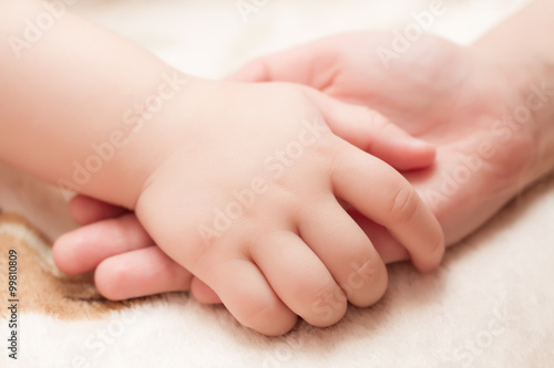 concept of love and family. Baby hands