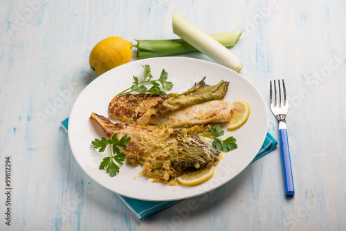Fototapeta Naklejka Na Ścianę i Meble -  oven fish fillet with leek and lemon grated peel