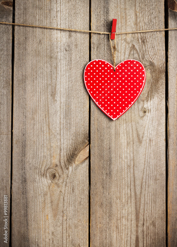 Red heart hanging on the clothesline for Valentines Day