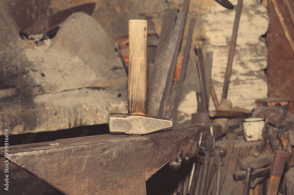 Hammer and anvil, detail of a forge, metal tools