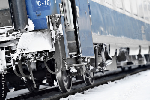 Train wagon buffers and links frozen in winter