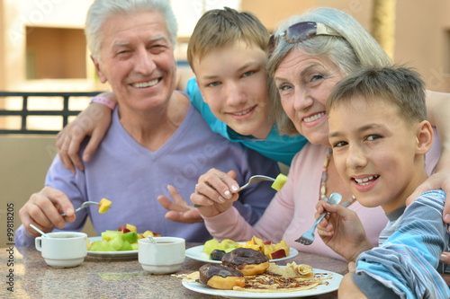 Grandparents with grandchildren at breakfast