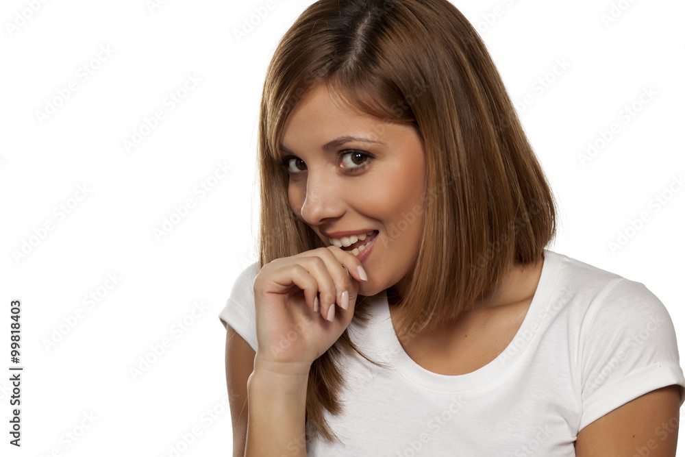 smiling a shy young woman on a white background smiling a shy young woman on a white background