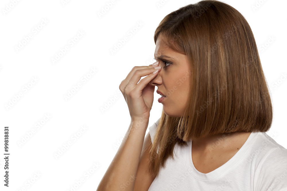 young beautiful woman has pain in the sinuses young beautiful woman has pain in the sinuses