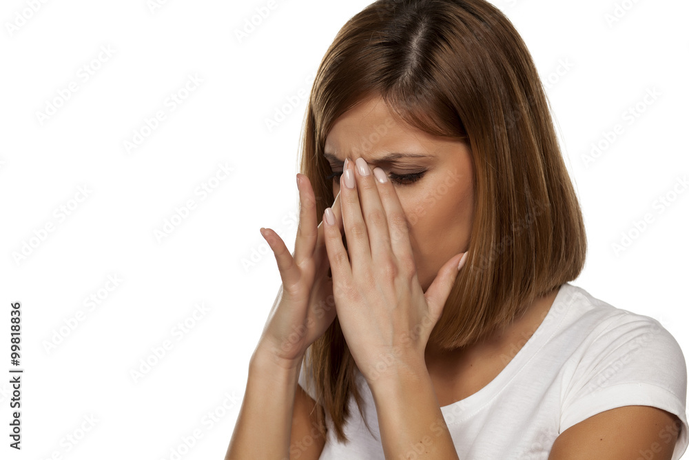 young beautiful woman has pain in the sinuses young beautiful woman has pain in the sinuses