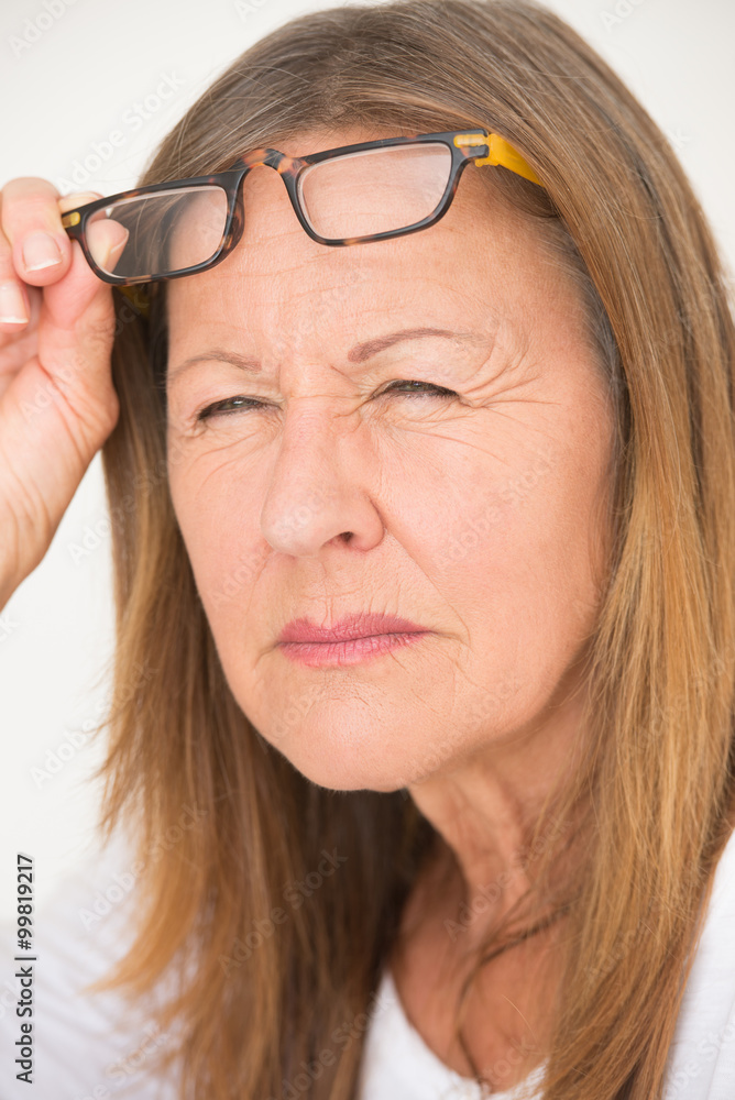 Woman with glasses and bad eyesight