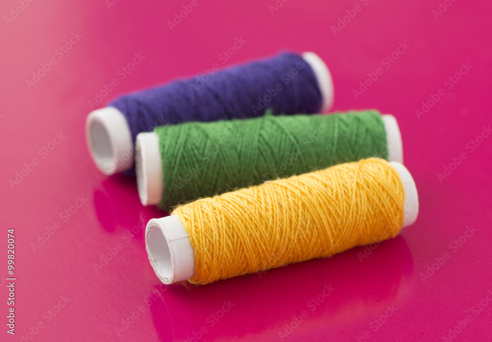 Spools with sewing thread