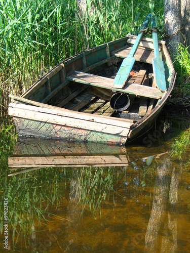 Old boat with reflection