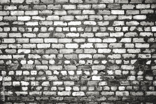 Dirty brick wall in monochrome