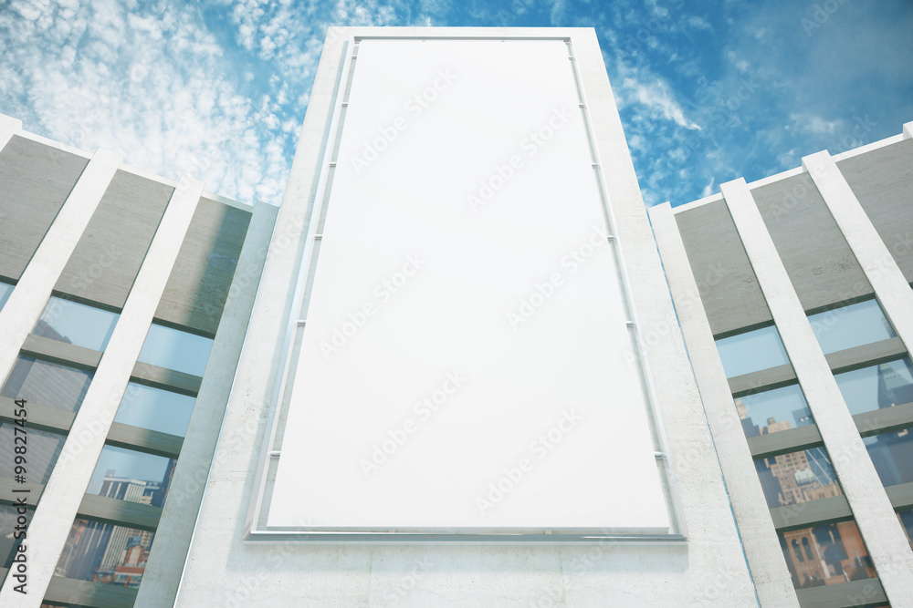 Large billboard on the wall of a building on a sky background Large billboard on the wall of a building on a sky background