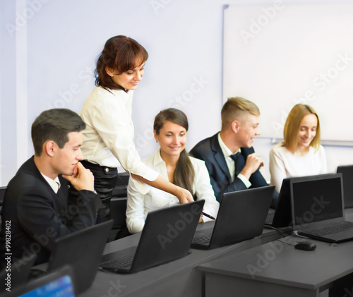 business, technology and office concept - smiling business team