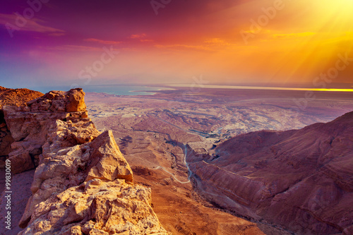 Beautiful sunrise over Masada fortress. Ruins of King Herod's palace in Judaean Desert.