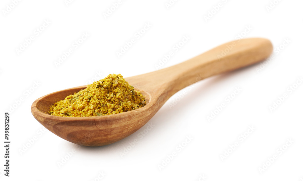 Wooden spoon of curry isolated Wooden spoon of curry isolated