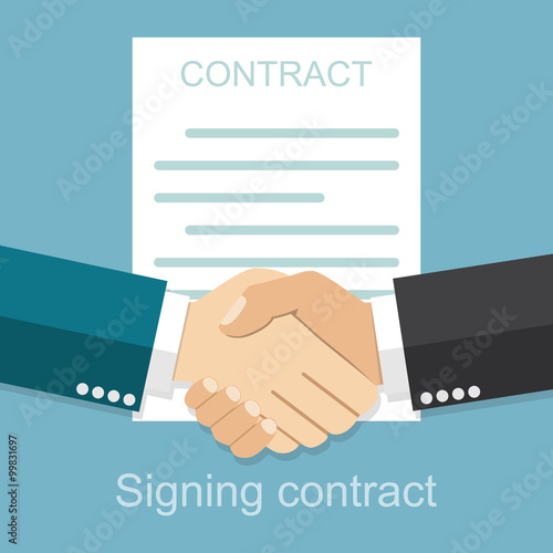 Handshake of business people on the background of the contract