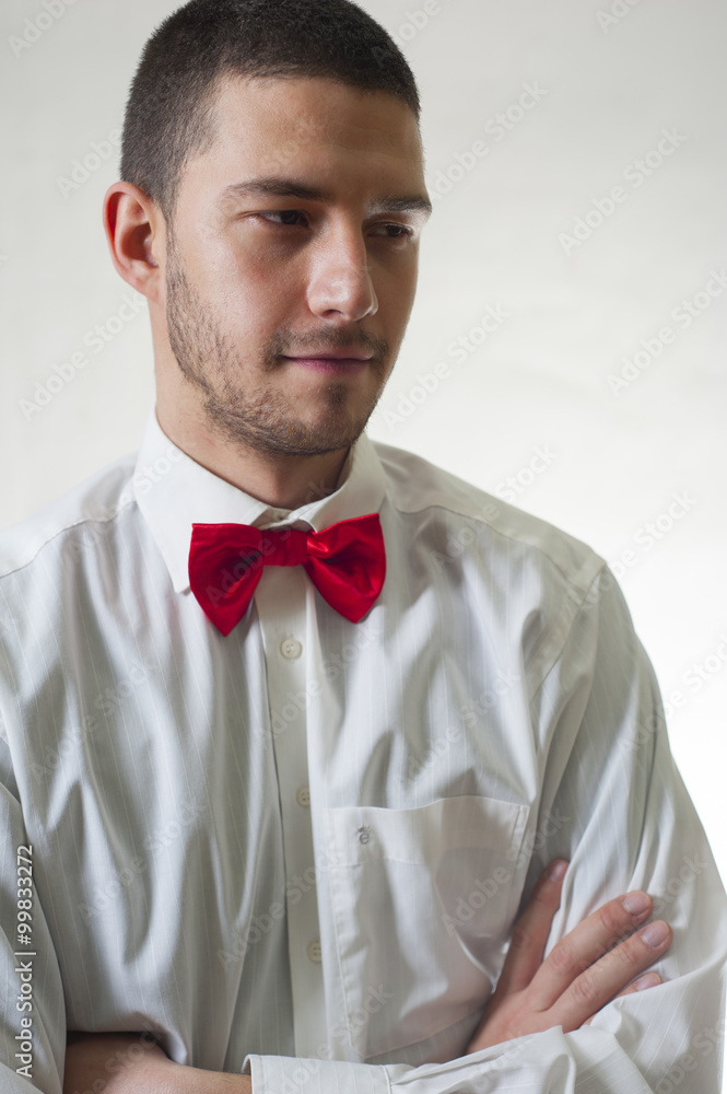 Young man with a bow tie in different outwear Young man with a bow tie in different outwear