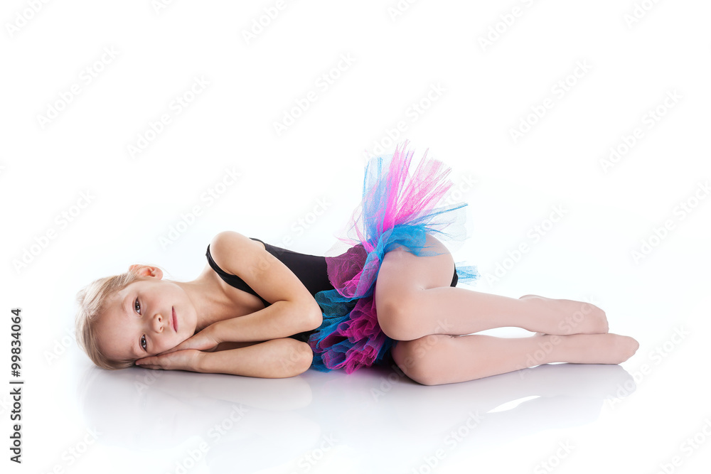 Naklejka premium Little girl 5-7 years old lying on the floor
