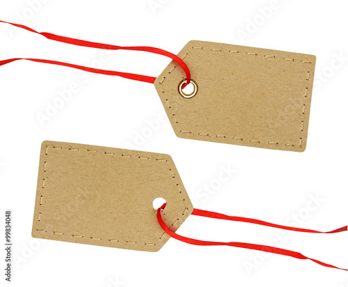 Cardboard labels on red ribbon